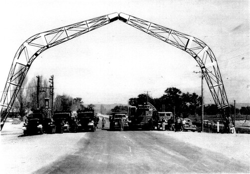Pollard Arch 1959 completed. Cars and workers lined up beneath the arch.