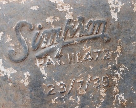 Simpson name and patent information on front of drum.