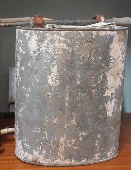 Simpson Knapsack made from galvanised iron with spray rod attached.