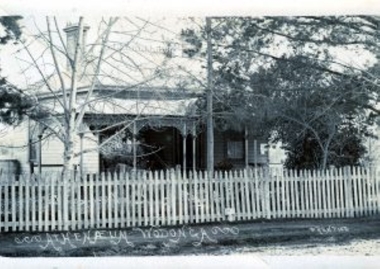 Old Atheneum Building behind picket fence