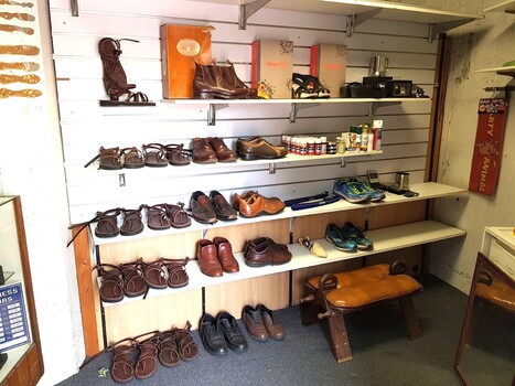 Shelves and shoes inside the Cobbler's Inn