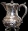 Ornate Silver teapot with engraving on front