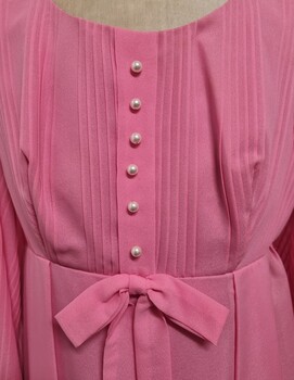 Detailed pintucking and buttons on bodice