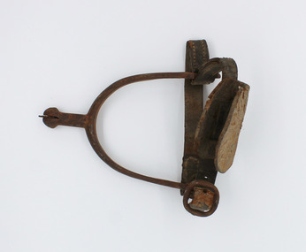 Spur with leather straps and rowel