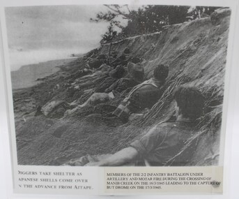 Photograph Laminated, Diggers take shelter as Japanese shells come over on the advance from AITAPE PNG