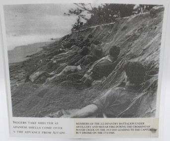 Photograph Laminated, Diggers take shelter as Japanese shells come over on the advance from AITAPE PNG