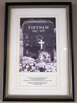 Framed photograph in portrait mode of commemorative stone at Repat Hospital: "VIETNAM 1962-1973".
