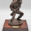 Sculpture of infantry soldier in traditional action pose.