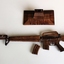 Wooden model of M16 rifle with 2 x magazines and a display stand.