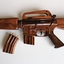 Wooden model of M16 rifle with 2 x magazines and a display stand.