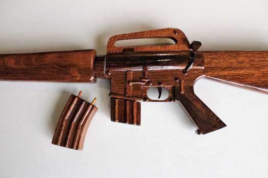 Wooden model of M16 rifle with 2 x magazines and a display stand.