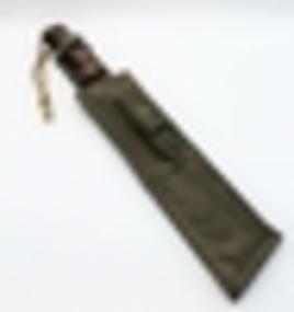 Machete in scabbard with sharpening stone - for use in the field.