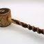 Comprises wooden plate made of dark coloured timber with gavel made of lighter coloured timber