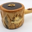 Comprises wooden plate made of dark coloured timber with gavel made of lighter coloured timber