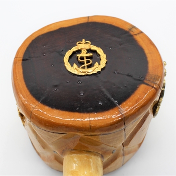 Comprises wooden plate made of dark coloured timber with gavel made of lighter coloured timber