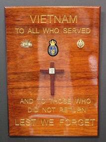 Plaque honouring 'Those Who Served' with symbols for three arms of the Defence Force.