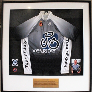 Framed VetRide jersey; predominantly black-white-grey with VetRide logo centrally placed.