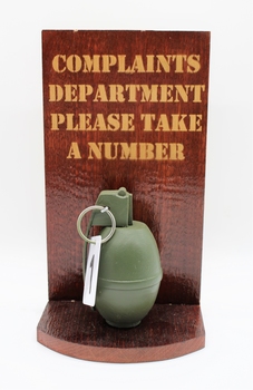 Novelty item: Hand Grenade for Complaints Department, 'Please take a number'.