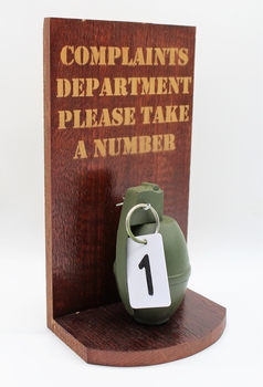 Novelty item: Hand Grenade for Complaints Department, 'Please take a number'.