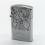 Period metal cigarette lighter; engraving of bird and girl on one side and text on reverse side. 