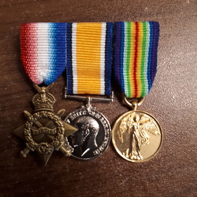 Three medals with ribbons from WW2.: 1st Medal is 'Victory Star; 2nd medal is xxx; 3rd Medal is 'Victory Medal'. 