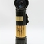 Army issued battery powered torch; olive drab in colour with beacon at right-angle to trunk.