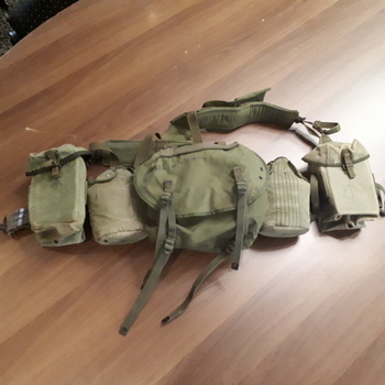 Webbing pack and belt carried most of personal belongings of soldier in the field: food, clothing, bedding and others.