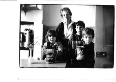 Photograph, War widow and her grandchildren, 1990