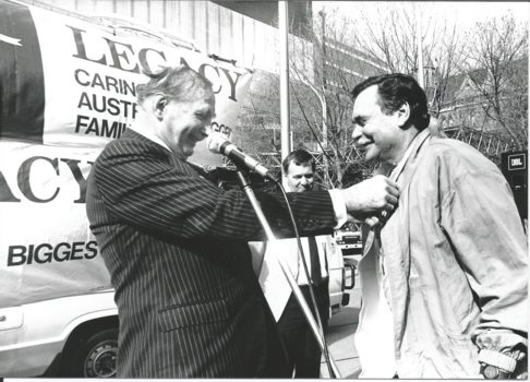 Sir Weary Dunlop and Ron Barassi at a Legacy Week event, a tug-of-war in the city square.