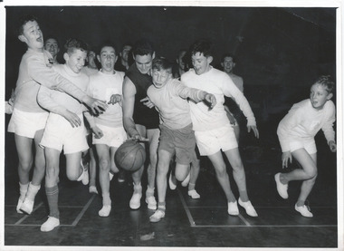 Photograph, Ron Barassi visits Junior Legatee basketball team, 1950s