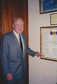 Photograph, President Stevenson with a diagram of Harefield Cemetery, 1993