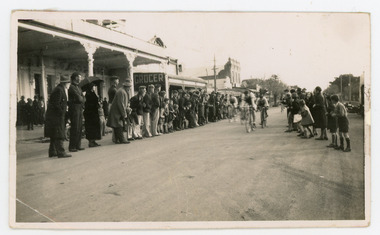 Photograph - Black and White Photograph, Cyclists, End of Race