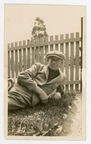 Photograph - Black and White Photograph, Cyclist lying on grass, 1920s