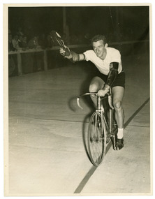 Photograph - Black and White Photograph, Cyclist, Barry Coster winning Geelong West Velodrome, 1956
