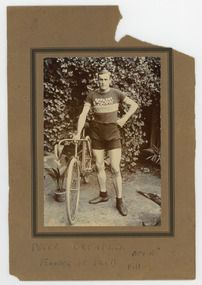 Photograph - Black and White Photograph, Cyclist, Peter Grundeel with many medals on shirt, 1911