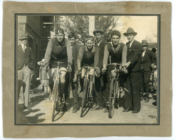 Photograph - Black and White Photograph, Three cyclists posing atop their bicycles, circa 1928