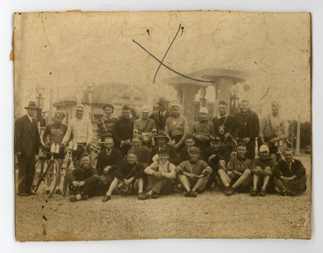 Photograph - Black and White Photograph, Cyclists, GACC group photo sitting on the ground