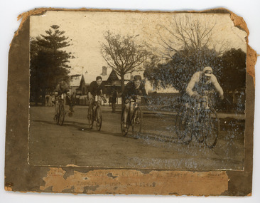 Photograph - Black and White Photograph, Four Cyclists racing on the street