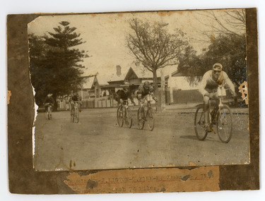Photograph - Black and White Photograph, Five Cyclists racing on the street