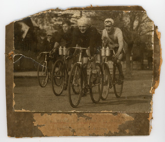Photograph - Black and White Photograph, Four Cyclists riding on the street