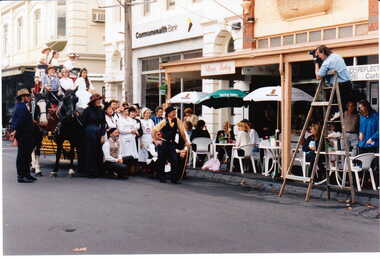 Photograph - Group of Maling Road traders posing for a photograph in period costume with the photographer in view in Maling Road, Jan Pigot, 27/03/1993 12:00:00 AM