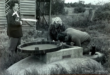 Photograph, Inspection of the underground well near the stables, 1973