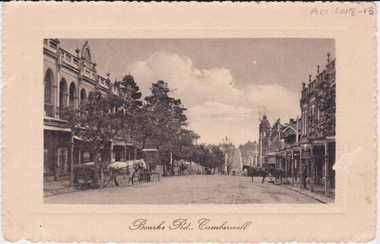 Postcard - Photo postcard, Postcard of Bourke Road, Camberwell, Unknown date but postcard probably dated circa 1900 - definitely pre 1913 because in that year gas lamps were removed from main roads, intersections, also street trees in Burke Road. Also no cars are visible on the street, only horses and carriages. In March 1894 the first streets in the central city of Melbourne were lit with electricity