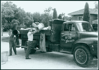 Photograph, Camberwell, Victoria, Garbage men loading rubbish into a Camberwell City Council truck, c. 1950
