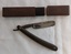 Two vintage Cut Throat Shaving Razors with brown bakelite handles - Bengall and Klein brands. One empty H. Boker and Co case.