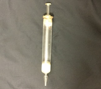 Glass hypodermic needle with plunger.
