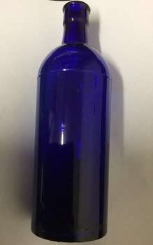 Blue castor oil bottle, with no stopper.