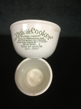 Quick cooker used for stews. Meat will keep hot for hours without overcooking and getting dry. White china with green lettering.