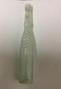 Opaque long neck bottle with etched, twisted pattern.