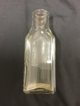 Clear Glass bottle, square shaped.